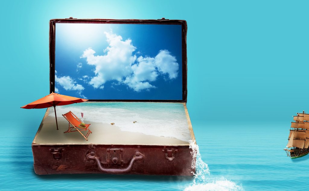 An imaginative scene where an open vintage suitcase displays a sandy beach with a chair and umbrella, merging into an ocean with a sailing ship, against a sky backdrop.